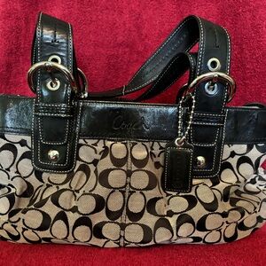 Coach buckle strap handbag. Black